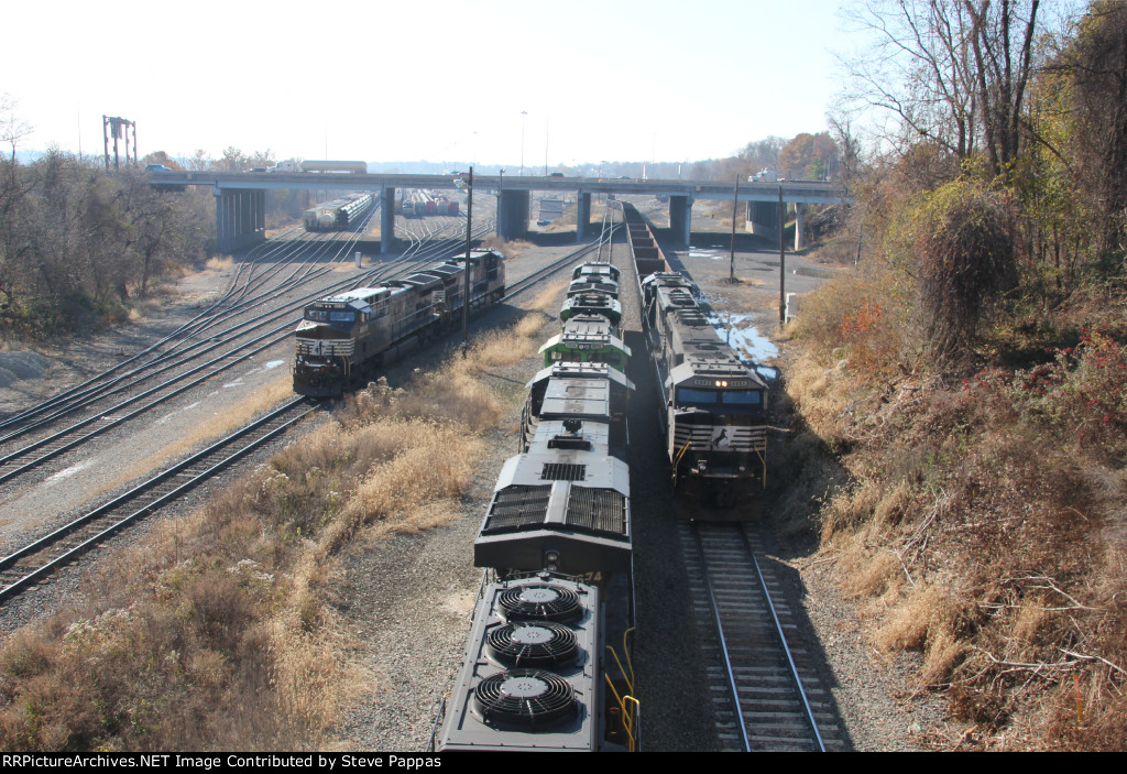 NS 6992 leads a train out of Enola yard, past 12R which awaits clearance